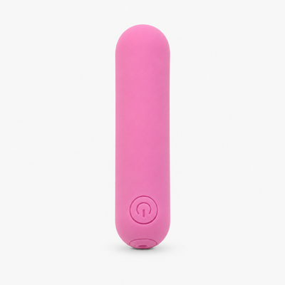 FlexToyz roze bullet vibrator met ronde powerknop op neutrale studioachtergrond