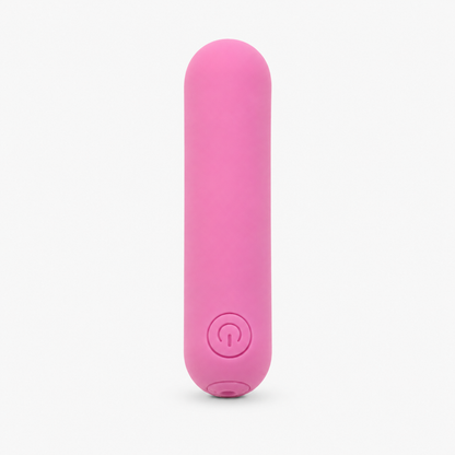 FlexToyz roze bullet vibrator met ronde powerknop op neutrale studioachtergrond