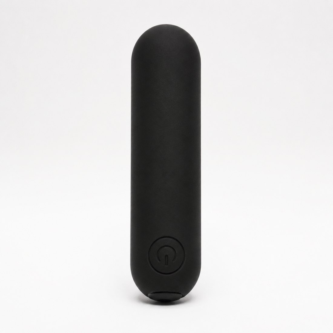 FlexToyz zwarte bullet vibrator met ronde powerknop op neutrale studioachtergrond