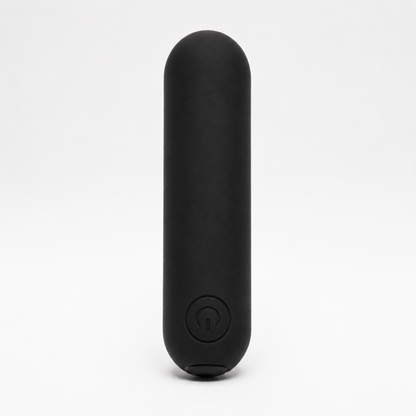 FlexToyz zwarte bullet vibrator met ronde powerknop op neutrale studioachtergrond